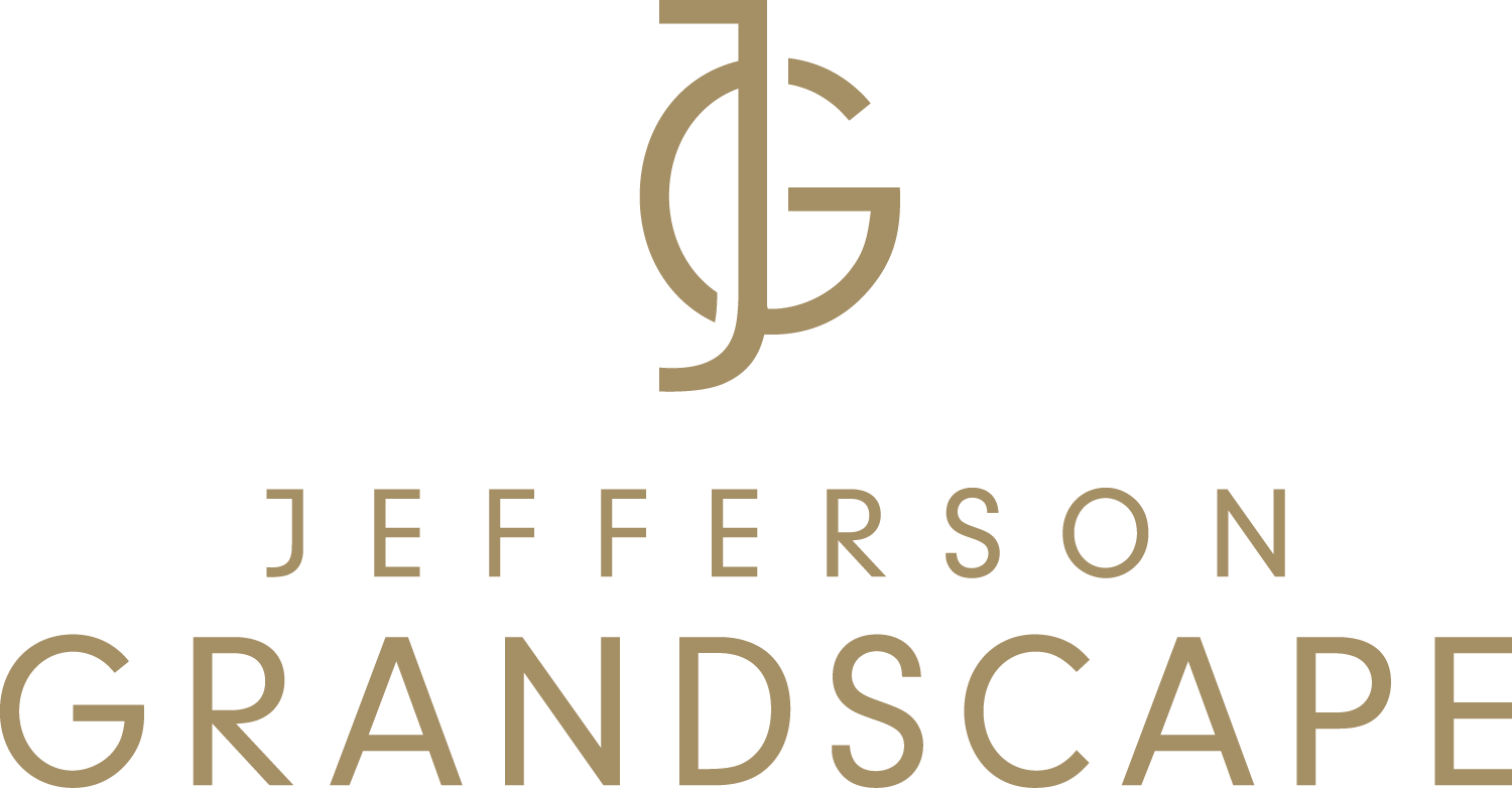 A logo with the text "Jefferson GrandScape" in gold on a black background.